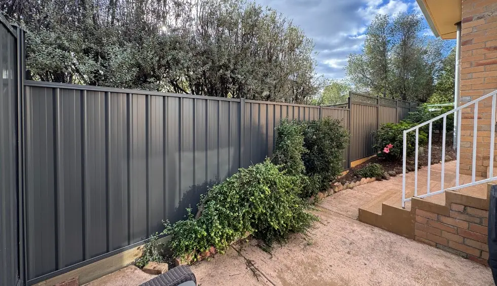 Contemporary Colorbond boundary fence for East Melbourne home