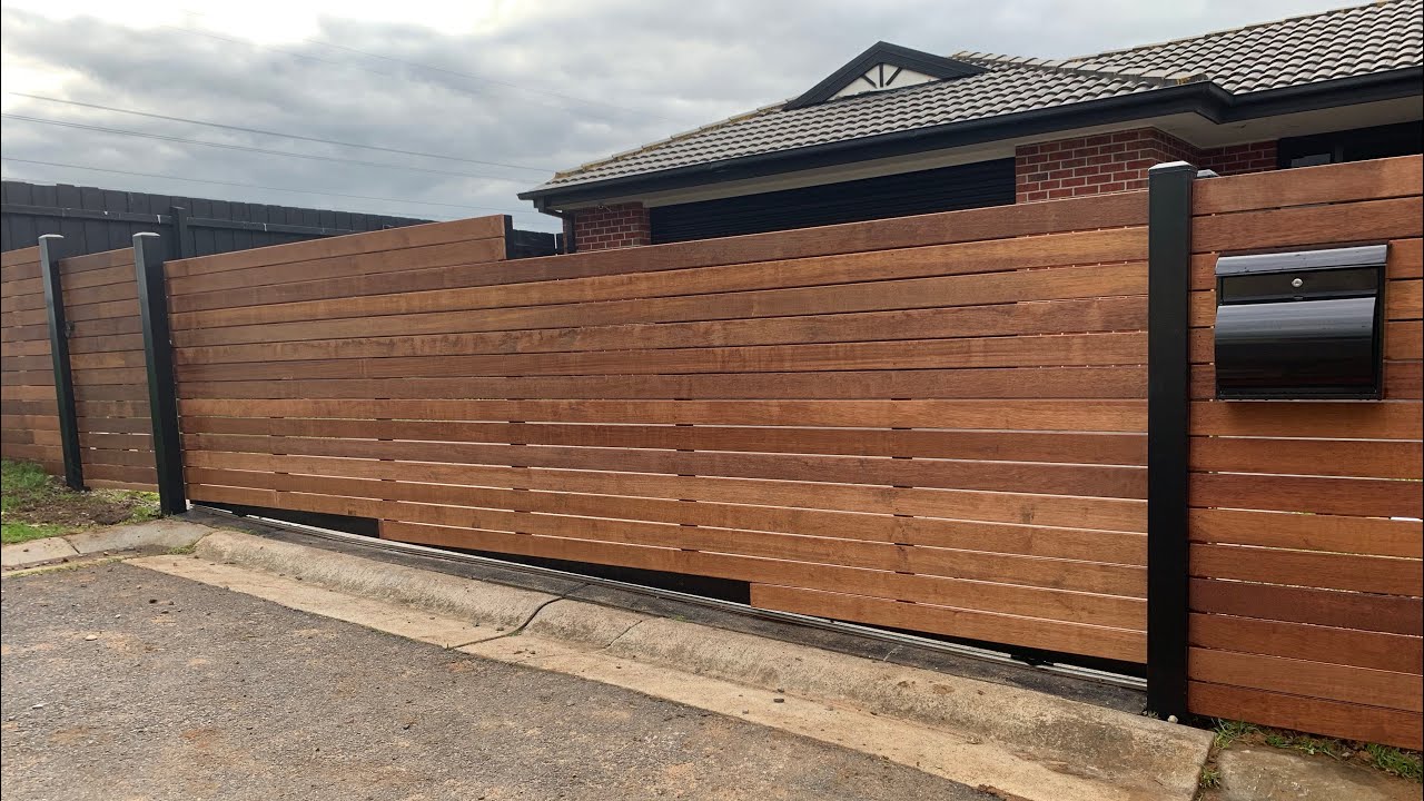 Horizontal Merbau front feature fence with automatic sliding gate