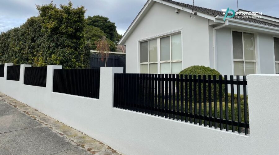 aluminium vertical blade fence with automatic gate installed by Pentagon fencing & gates in Melbourne - Durable Fence Options for Severe Weather in Melbourne