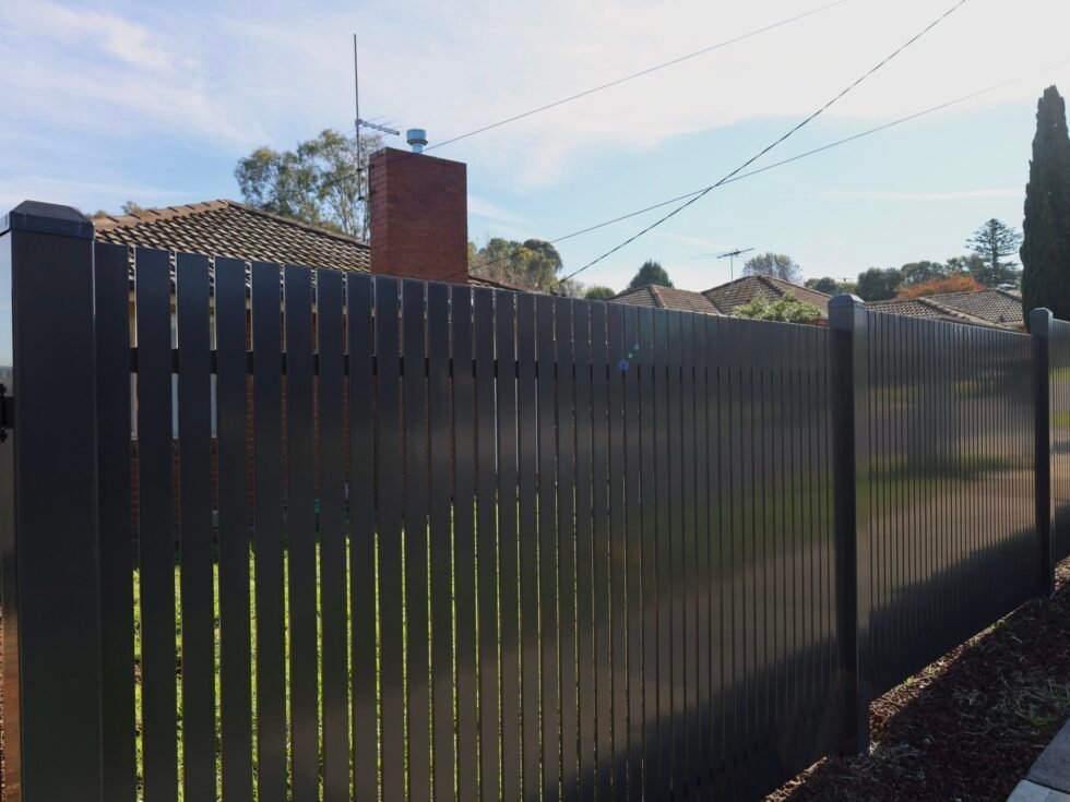 Aluminium Fencing Melbourne - Commercial & Residential 24 Aluminium vertical slat fence with driveway gates for front facade scaled e1779687432850